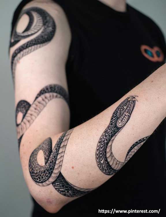 tribal snake and dagger tattoo