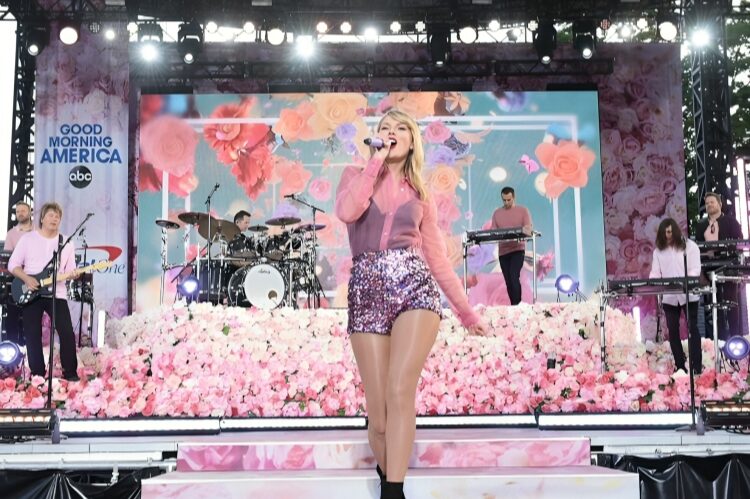 A fun sequined mini dress in silver and metallic shades, styled for stage performance.