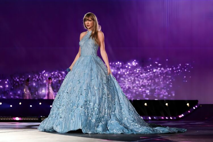 A glamorous digital painting of Taylor Swift in a shimmering midnight blue sequin gown, surrounded by glowing stars