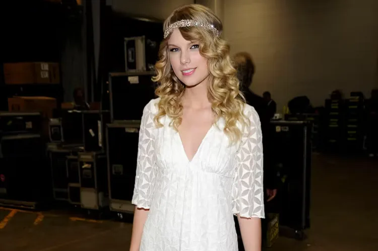 Taylor Swift in a glittering silver mini dress paired