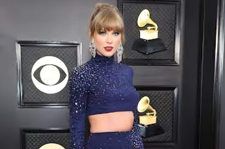 Taylor Swift in a navy-blue Moschino romper embellished with celestial stars and moons.