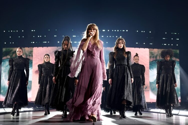Taylor Swift in designer-made outfits by Versace, Roberto Cavalli, and Oscar de la Renta.