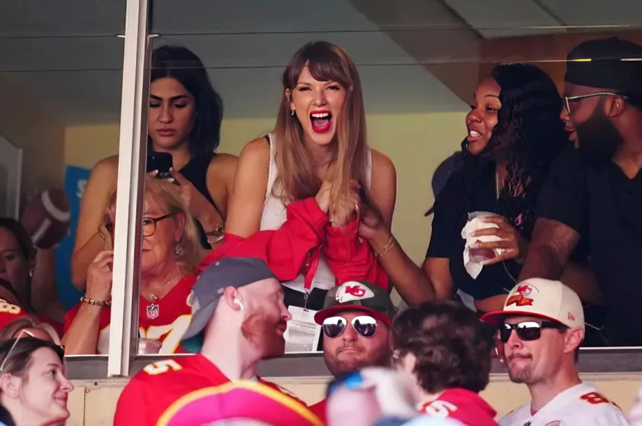 Excited Taylor Swift fans analyzing hidden clues